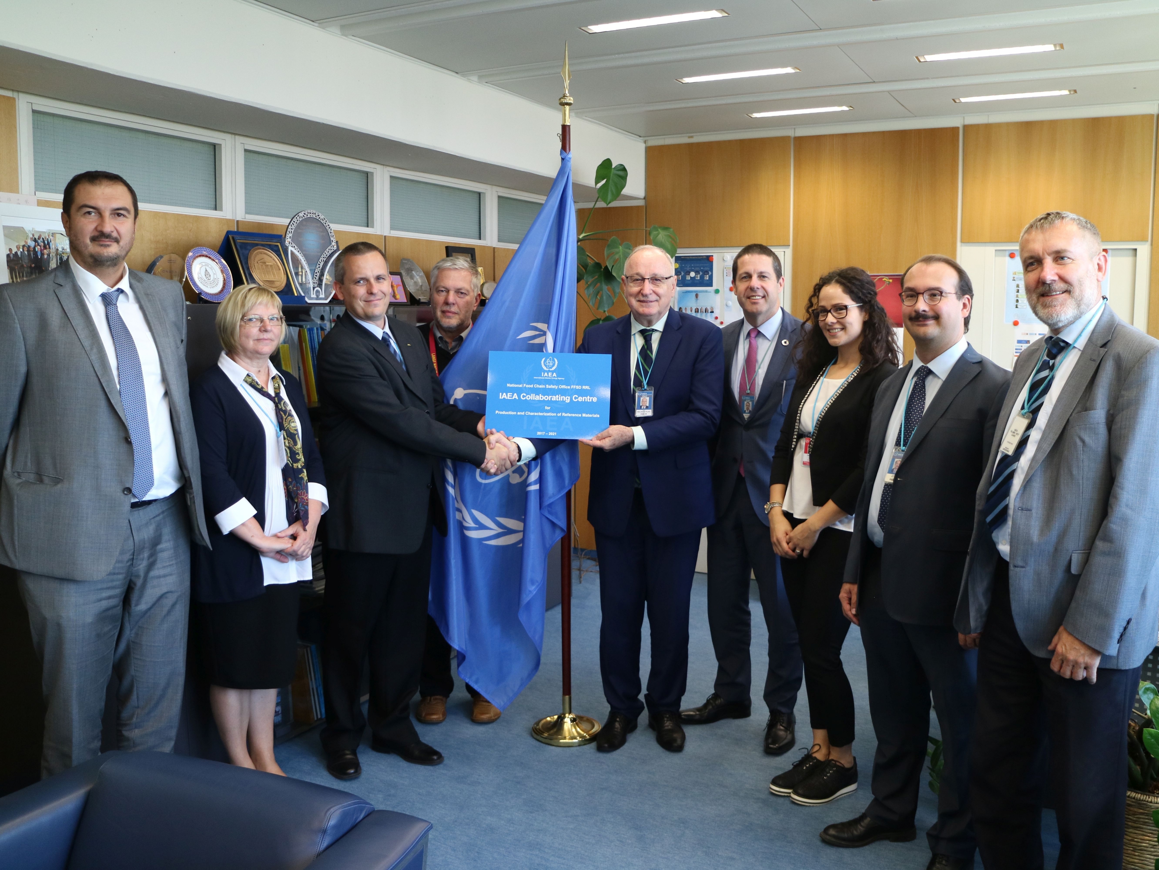 Aldo Malavasi, Deputy Director General and Head of the Department of Nuclear Sciences and Applications, hands over the Collaborating Centre redesignation plaque to Dr. Attila Nagy, Deputy Director of Hungary's National Food Chain Safety Office