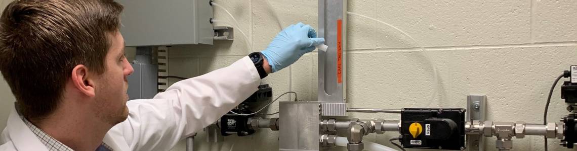 Neutron activation analysis (NAA) in action: a sample is being inserted in the pneumatic system that will take it close to the reactor’s core to be irradiated. (Photo: S.Landsberger/University of Texas) 