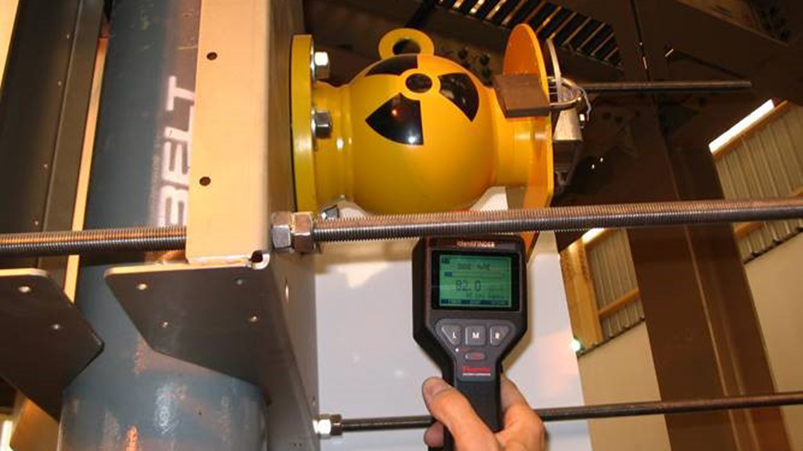A nuclear gauge is used to take material density measurements