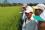 Photo 6 of 14 : Village farmers in Dong Tien line up to view the green fields of rice crops in Southeast Vietnam's Binh Phuoc province.  Soil conditions there are poor and farmers work closely with the country's Institute of Agricultural Science in Ho Chi Minh City.  The country's rice breeding and development projects are supported by the IAEA through its research and technical cooperation programmes. 
