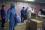 Workers entering and leaving the Emergency Response Centre. Masks are worn outside the centre to prevent the inhalation of radioactive particles. Protective clothing includes a double layer of rubber gloves, and disposable overalls made of an extremely strong, lightweight fabric.