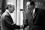 Dr. Michael J. Higatsbrerger, Managing Director of the Austrian Society of Atomic Energy Studies (right), and Dr. Henry Seligman, Deputy Director General of the IAEA, shake hands after the signing agreement to lease the Seibersdorf laboratory site to the IAEA.