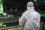 Ilia Kuzmin, an expert member of the IAEA mission team from Russia, peers into the emptied spent fuel pool in Unit 4.