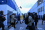 Security officers, along with the international media and journalists, follow French President Emmanuel Macron from one hall to the next at the Scottish Event Campus of the UN Climate Change Conference (COP26) in Glasgow, Scotland, the United Kingdom, 1 November 2021.