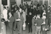 Participants during informal conversation somewhere outside the conference room. Lyman Spitzer, inventor of the stellarator device, can be seen crossing the room holding a book.
(IAEA Archives/Credit: Photo Ellinger)