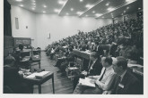 The opening of the 2nd Fusion Energy Conference in Culham, United Kingdom, 6-10 September 1965, with Sir John Cockcroft, Master of Churchill College, welcoming the delegates. 
Delegates from 26 countries fill the Culham Lecture Theatre. 
(IAEA Archives/Credit: UKAEA, United Kingdom)