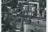 General view of the CLEO device at Culham Laboratory in tokamak configuration.
Part of the control room and diagnostic area are shown in the foreground with the toroidal plasma confinement device in the background.
The CLEO team tested different magnetic fields configurations (i.e. tokamak, stellarator, reversed field pinch) on the same device to study and compare the plasma confinement properties of the various systems.
(IAEA Archives/Credit: UKAEA, United Kingdom)
