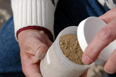 A sample of sulphur phosphate, which contains a small amount of uranium. Photo Credits: Pavlicek/IAEA